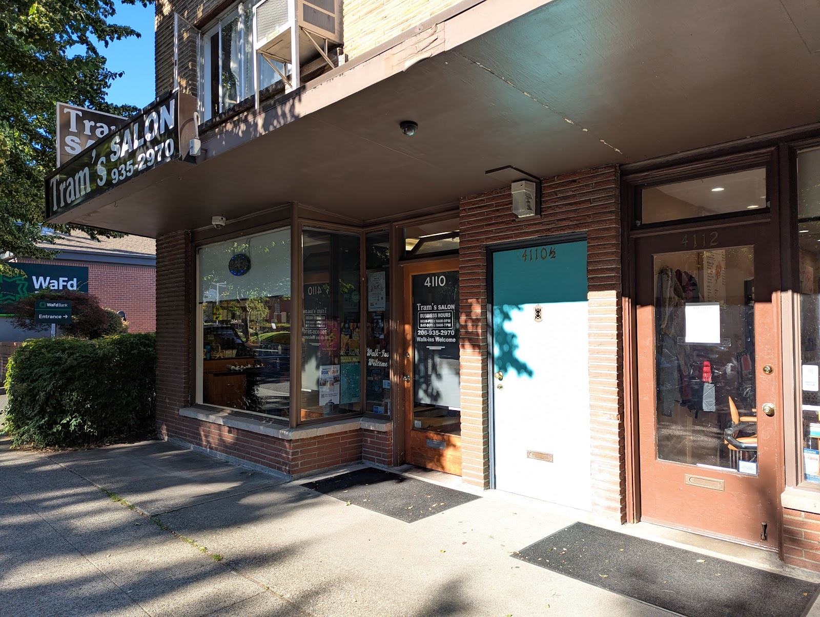 Tram's Salon entrance with Walk-Ins Welcome signage on California Ave SW