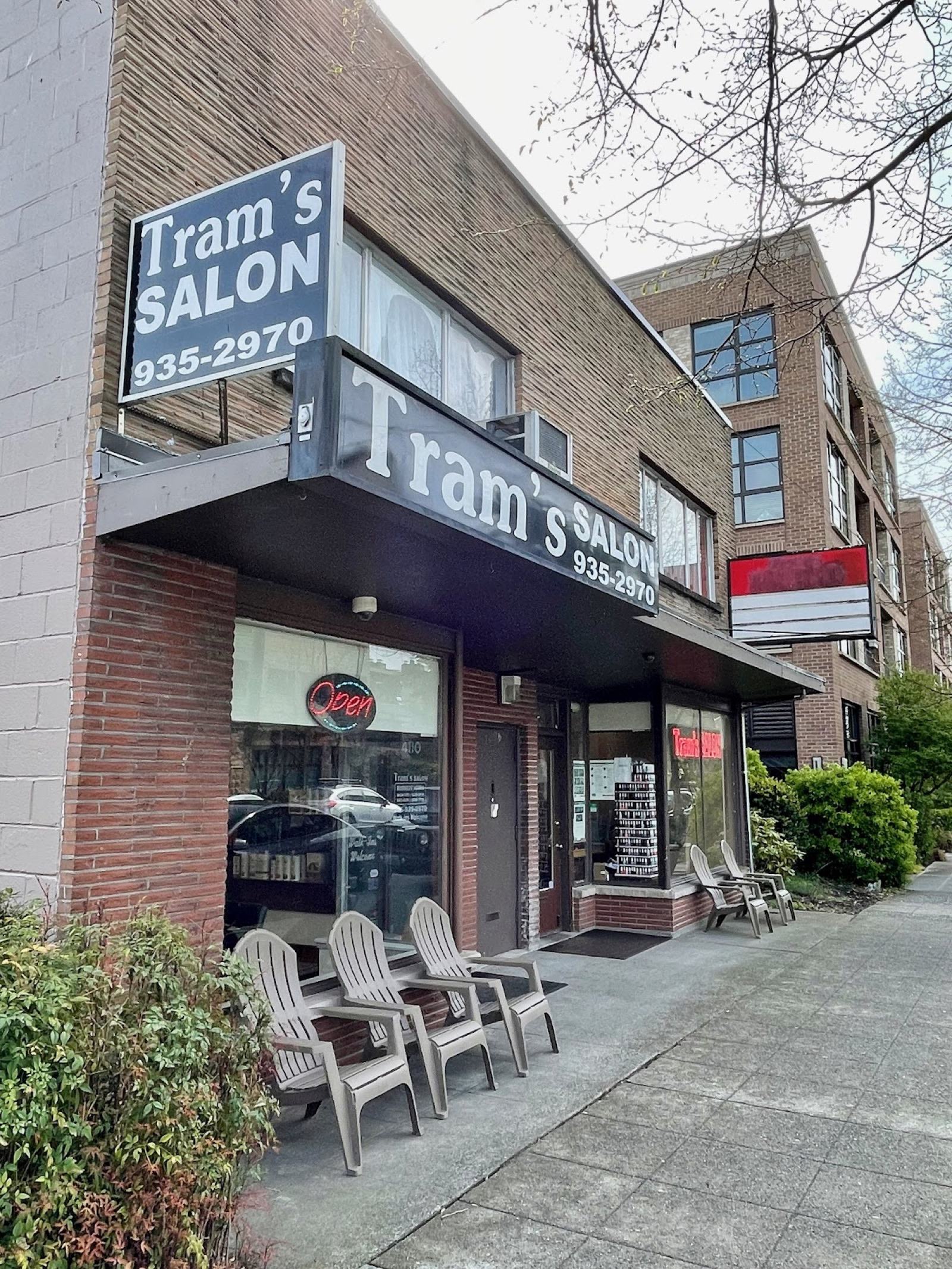 Street view of the Tram's Salon storefront sign in West Seattle's Junction